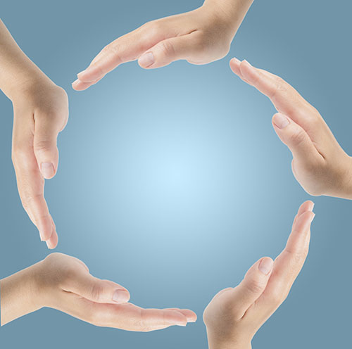 Group of hands forming a circle isolated on blue background